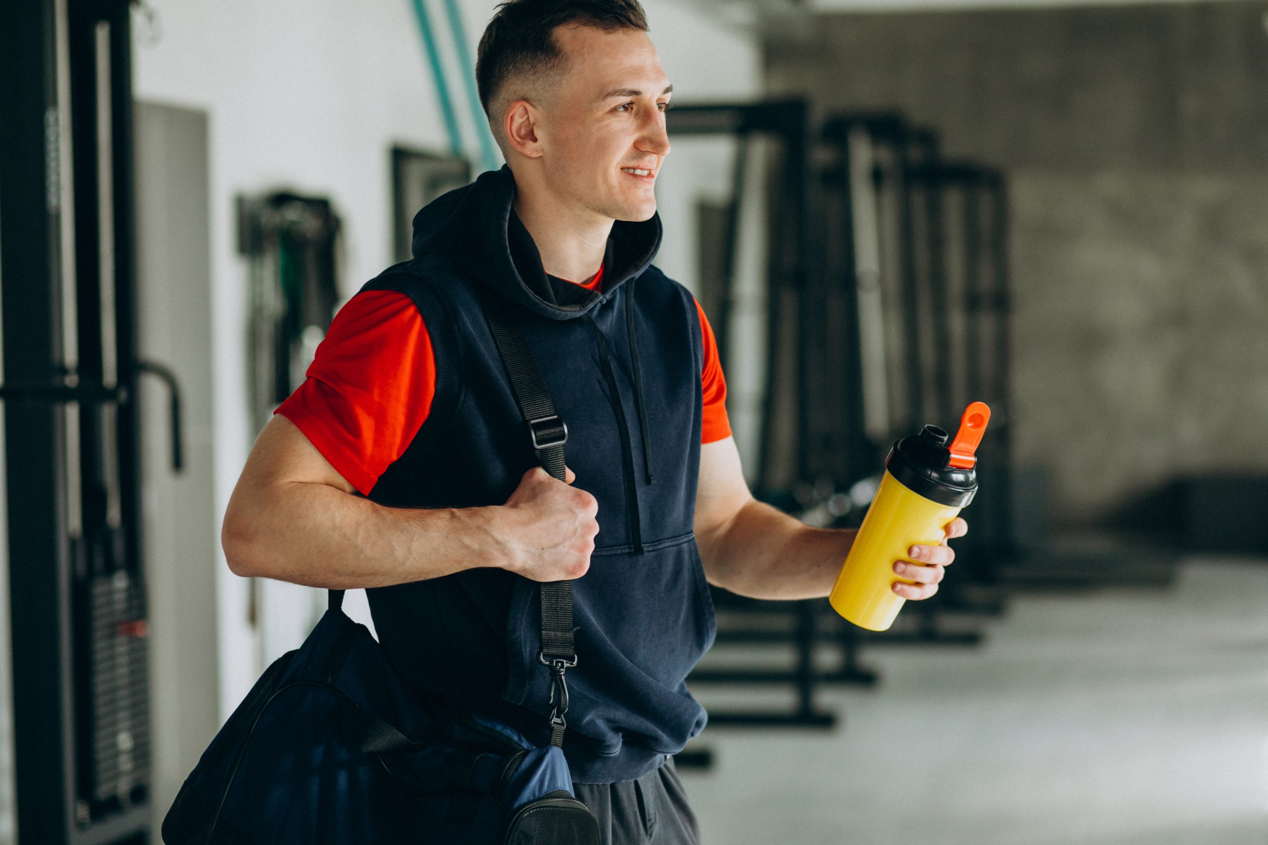 Young handsome man in sportswear at the gym